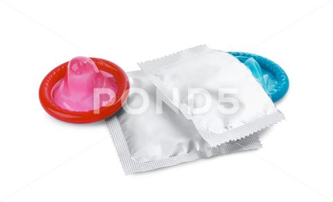 Unpacked condom and packages on white background. Safe sex aids background barrier birth care color colorful condom condoms contraception contraceptive control disease education health healthy hiv illness infection isolated latex lifestyle male many medical medicine object packages pharmacy pink pregnancy prevention protect protection risk rubber safe safety security sex sexual silver std sti torn unpacked unwrapped venereal virus white