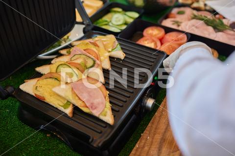 Modern grill maker and sandwiches on white table breakfast fast cheese tomato food hot cooking panini bread lunch sandwich melted toast background table kitchen green grill temperature equipment appliance easy nobody item device object wholewheat cook toaster tasty dinner machine iron house maker meal technology fresh roasted homemade culinary healthy electric grilled domestic leaves modern snack natural