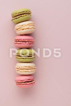 Macaroons on pink background, colorful french cookies pattern. Gift for 8 March, International Women's Day, Valentine Day. Vertical banner with copyspace macaroon traditional macaron sweet cookie confectionery biscuit french colorful pastry macaroons snack chocolate tasty pastel cream background sugar assortment food dessert cake bakery closeup delicious pink candy color green white top yellow french macaroons falling pastel colored coffee delicate lemon overhead vanilla confection delicious macaroon macarons colourful pattern banner