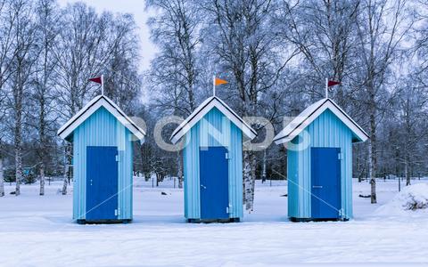 Blue cabanas on the beach for changing clothes, winter beach in Oulu architecture beautiful blue cold country day fence finland forest frost frozen garden home house ice landscape nature oulu outdoor outdoors red row season sky snow snowy tree trees white winter wood wooden north ostrobothnia no people
