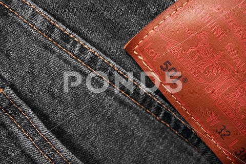 Close up of the details of new LEVI'S 501 Jeans. label and patch LEVI'S. Classic jeans model. LEVI'S is a brand name of Levi Strauss and Co, founded in 1853. 31.12.2021, Rostov, Russia. denim jean levi levi strauss casual clothing 501 trendy levis levis jeans brand fashion clothes blue cotton logo company label fabric pocket trousers casual denim jeans popular culture logo levi levi s levi jeans levi 501 lifestyle blue jeans closeup traditional icon fragment famous editorial retro fiber canvas american detail design strauss material textile classic clothing element trademark travel