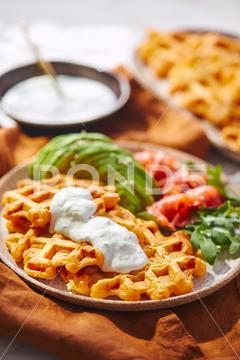 Hearty sweet potato or pumpkin waffles with avocado, salmon, arugula and sauce waffle salmon sweet potato pumpkin breakfast avocado healthy food delicious meal dinner lunch tasty fish morning dish snack homemade diet plate fresh green vegetable brunch cooking background gourmet salad smoked baked epicure bread toast sauce belgian healthy breakfast wafer fat eating organic fast food nourishment smoked salmon herb belgian waffles ketogenic arugula