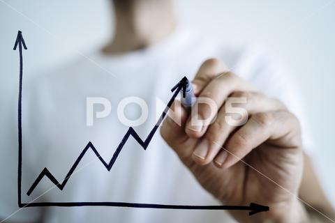 Business growth sale concept. Hand draws a graph of economic profit growth and development. High quality photo business growth sale 2024 development chart profit finance investor graphic graph grow drawing rise arrow goal market success economy economic plan concept benefit stock company education up financial advice trend invest achievement revenue diagram progress money strategy increase analysis businessman corporate earnings vision competition expect smart black career improvement consultant