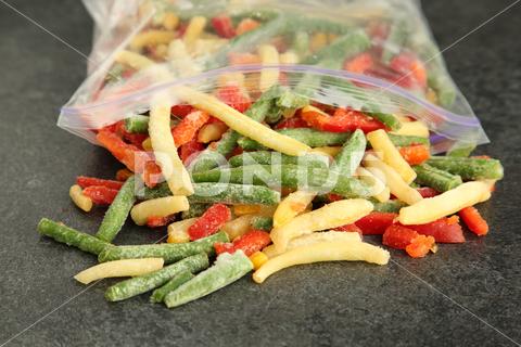 Zip bag with different frozen vegetables on grey table, closeup asparagus assortment background bag carrot closeup cold cooking cut delicious diet different eating food freeze freezer freezing fresh frost frozen grey health healthy homemade ice ingredient kitchen meal mix mixed natural nutrition object organic pepper product raw storage table tasty various vegan vegetable vegetables vegetarian vitamin zip