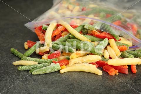Zip bag with different frozen vegetables on grey table, closeup asparagus assortment background bag carrot closeup cold cooking cut delicious diet different eating food freeze freezer freezing fresh frost frozen grey health healthy homemade ice ingredient kitchen meal mix mixed natural nutrition object organic pepper product raw storage table tasty various vegan vegetable vegetables vegetarian vitamin zip