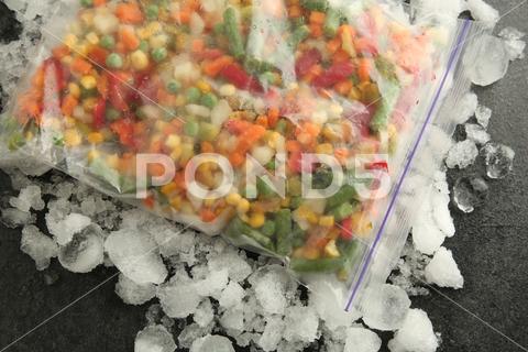 Zip bag with different frozen vegetables and ice on grey table, top view asparagus assortment background bag carrot cold cooking corn cut delicious diet different eating flat food freeze freezer freezing fresh frost frozen grey healthy homemade ice ingredient kitchen lay meal mix mixed natural nutrition object organic peas pepper product raw storage table tasty top various vegan vegetables vegetarian view vitamin zip
