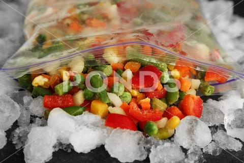 Zip bag with different frozen vegetables and ice on table, closeup asparagus assortment background bag carrot closeup cold cooking corn cut delicious diet different eating food freeze freezer freezing fresh frost frozen grey health healthy homemade ice ingredient kitchen meal mix mixed natural nutrition object organic peas pepper product raw storage table tasty various vegan vegetable vegetables vegetarian vitamin zip