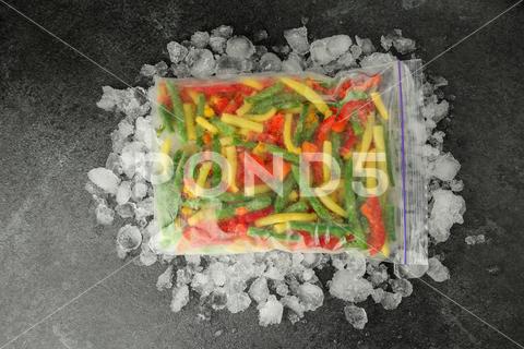Zip bag with different frozen vegetables and ice on grey table, top view asparagus assortment background bag carrot cold cooking corn cut delicious diet different eating flat food freeze freezer freezing fresh frost frozen grey health healthy homemade ice ingredient kitchen lay meal mix mixed natural nutrition object organic pepper product raw storage table tasty top various vegan vegetables vegetarian view vitamin zip