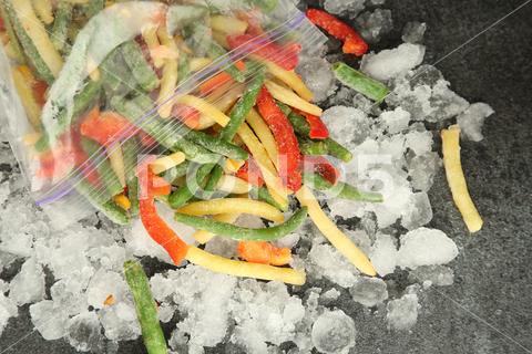 Zip bag with different frozen vegetables and ice on grey table, top view asparagus assortment background bag carrot cold cooking corn cut delicious diet different eating flat food freeze freezer freezing fresh frost frozen grey health healthy homemade ice ingredient kitchen lay meal mix mixed natural nutrition object organic pepper product raw storage table tasty top various vegan vegetables vegetarian view vitamin zip