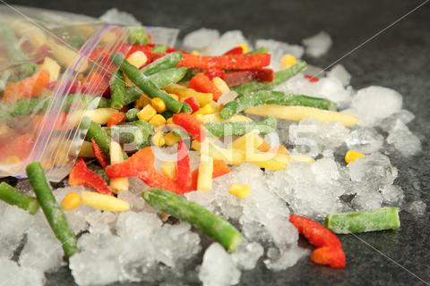 Zip bag with different frozen vegetables and ice on grey table, closeup asparagus assortment background bag carrot closeup cold cooking corn cut delicious diet different eating food freeze freezer freezing fresh frost frozen grey health healthy homemade ice ingredient kitchen meal mix mixed natural nutrition object organic pepper product raw storage table tasty various vegan vegetable vegetables vegetarian vitamin zip