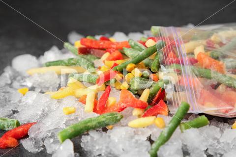 Zip bag with different frozen vegetables and ice on grey table, closeup asparagus assortment background bag carrot closeup cold cooking corn cut delicious diet different eating food freeze freezer freezing fresh frost frozen grey health healthy homemade ice ingredient kitchen meal mix mixed natural nutrition object organic pepper product raw storage table tasty various vegan vegetable vegetables vegetarian vitamin zip
