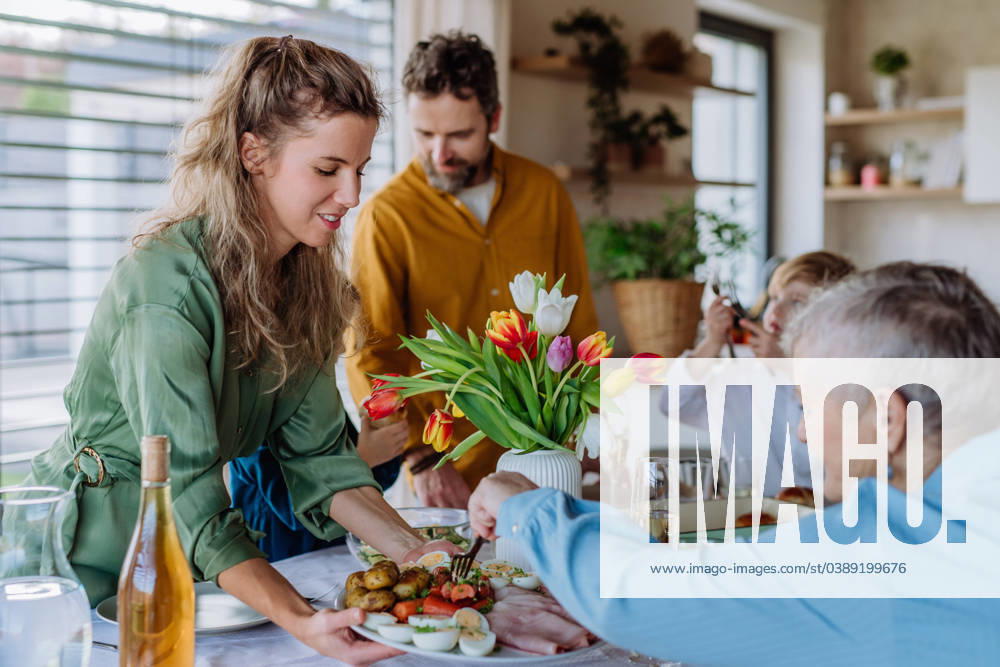 Happy multigenertional family having Easter dinner together. Happy multigenertional family having Easter lunch together. model released