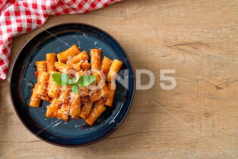 Rigatoni pasta with tomato sauce and cheese - traditional Italian pasta background basil bolognese cheese cream creamy cuisine diet dinner dish fat food gourmet grain harvest health healthy homemade ingredient italian macaroni meal meat mediterranean nutrition orange organic parmesan parsley pasta penne produce product protein recipe red rigatoni sauce spaghetti table tomato traditional vegan vegetables vegetarian veggies
