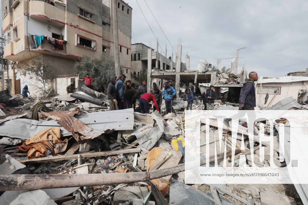 Palestinians inspect destruction after an Israeli bombing of El- Rawagh family house in Nusairat Palestinians inspect destruction after an Israeli bombing of El- Rawagh family house in Nusairat, Gaza on January 26, 2024. Several buildings were collapsed or heavily damaged after the attack. Photo by Omar Ashtawy apaimages Nusairat Gaza Strip Palestinian Territory 260124_Nusairat_OSH_00(41)