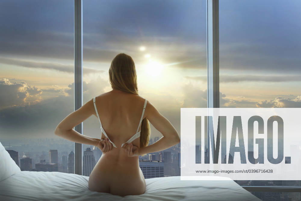 Caucasian woman undressing and admiring cityscape in window New York, New York, Usa, 14.07.2010, model released, TTBB_BLD158409.jpg, 20-24 years, admiring, bare, beauty, beauty in nature, bed, bedroom, bra, caucasian, challenge, city, cityscape, cloud, color image, confident, day, domestic life, dressing, focus on foreground, goal, horizontal, indoors, lens flare, long hair, looking at view, New York, one person, people, photography, rear view, scenic view, sexy, sitting, skyline, straight hair, sun, sunbeam, sunrise, sunset, tranquility, travel, travel destinations, undressing, United States, urban, waist up, window, woman, young adult, young women, , ethereal, millennial20-25, 20-30, 20s, 20s, 25-30, admiration, admirer, adult, america,