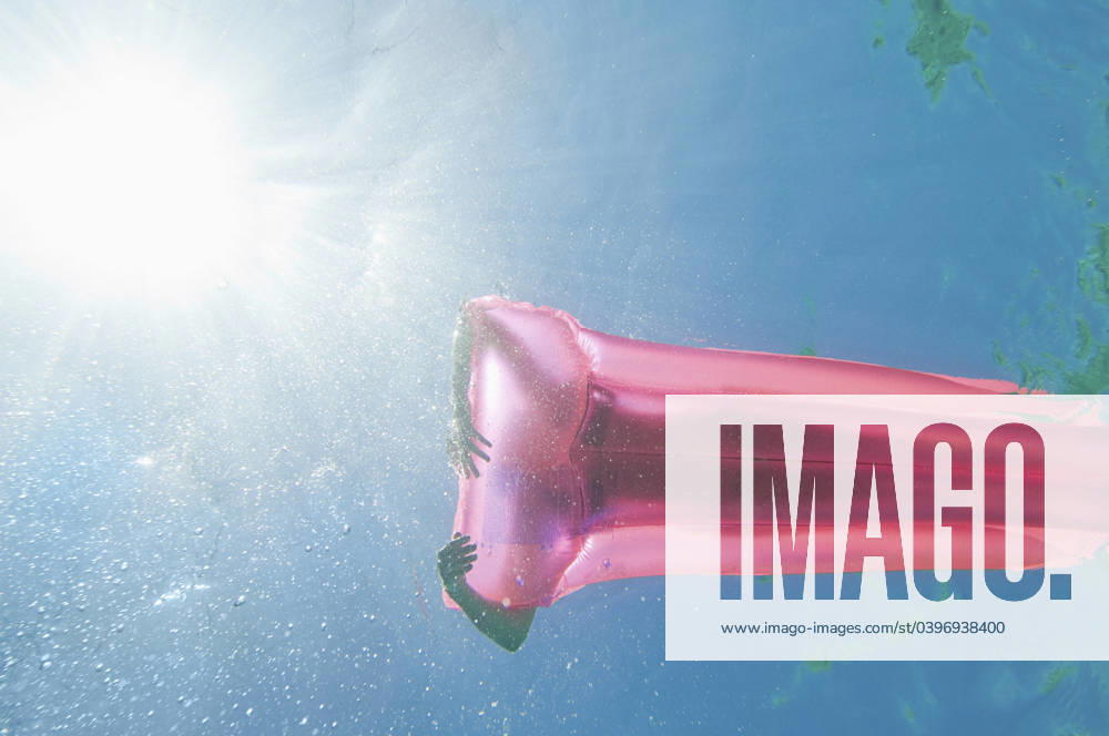 Underwater view of woman sunbathing on raft in ocean Stintino, Sassari, Italy, 21.12.2023, model released, TTBB_BLD170656.jpg, 45-49 years, adventure, authentic, authenticity, calm, carefree, caucasian, color image, copy space, day, enjoying, floating, freedom, full length, fun, getting away from it all, happy, high angle view, horizontal, inflatable mattress, inflatable raft, italy, journey, lake, laying, laying down, leisure activity, lifestyle, mature adult, mature women, ocean, one person, outdoors, peace, people, photography, pink, pool raft, raft, real people, recreation, relaxation, sardinia, sassari, serene people, serenity, silhouette, stintino, summer, sun, sunbathing, sunlight, sunny, swimming, tranquil scene, tranquility, trave