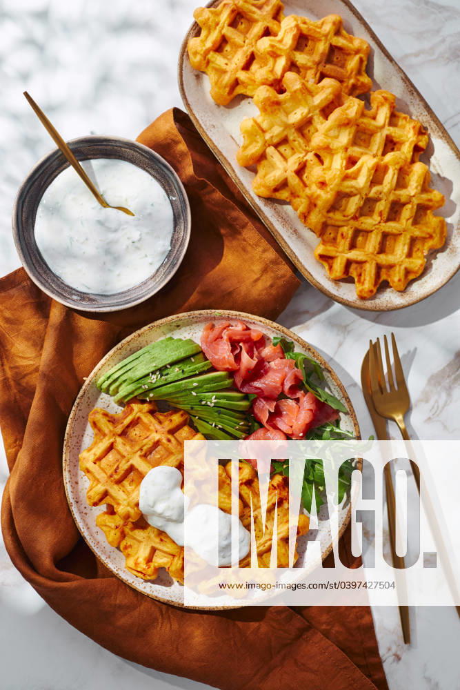 Hearty sweet potato or pumpkin waffles with avocado, salmon, arugula and sauce Hearty sweet potato or pumpkin waffles with avocado, salmon, arugula and sauce
