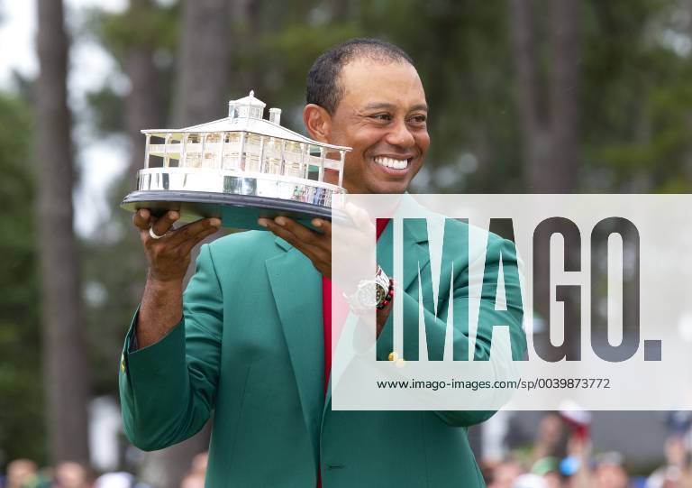 Tiger Woods holds the Masters Trophy wearing his newly won Green Jacket after the final round at the 2019 Masters Tournament at Augusta National Golf Club in Augusta, Georgia, on April 14, 2019. Tiger Woods wins the Masters with a score of 13 under par for his 5th Green Jacket. AUG20190414920 JOHNxANGELILLO