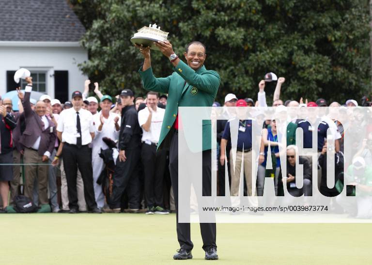 Tiger Woods holds the Masters Trophy wearing his newly won Green Jacket after the final round at the 2019 Masters Tournament at Augusta National Golf Club in Augusta, Georgia, on April 14, 2019. Tiger Woods wins the Masters with a score of 13 under par for his 5th Green Jacket. AUG20190414922 JOHNxANGELILLO