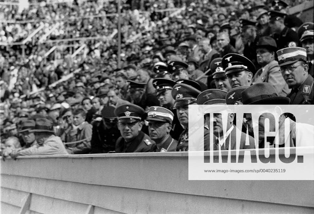 Summer Olympics 1936 - Germany, Third Reich - Olympic Games Olympische Spiele Olympia OS Summer Olympics 1936 in Berlin. Reich Chancellor Adolf Hitler during the competitions - among the spectators. Image date August 1936. , Berlin Deutsches Reich