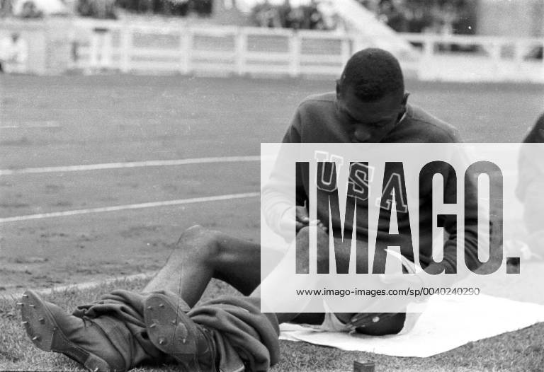 Summer Olympics 1936 - Germany, Third Reich - Olympic Games Olympische Spiele Olympia OS Summer Olympics 1936 in Berlin. Jesse Owens during a break at the Olympic arena. The most successful athlete of the Berlin Olympics. Gold medal winner in 100 m and 200 m sprint, 4 x 100 m relay and long jump. Image date August 1936. , Berlin Deutsches Reich