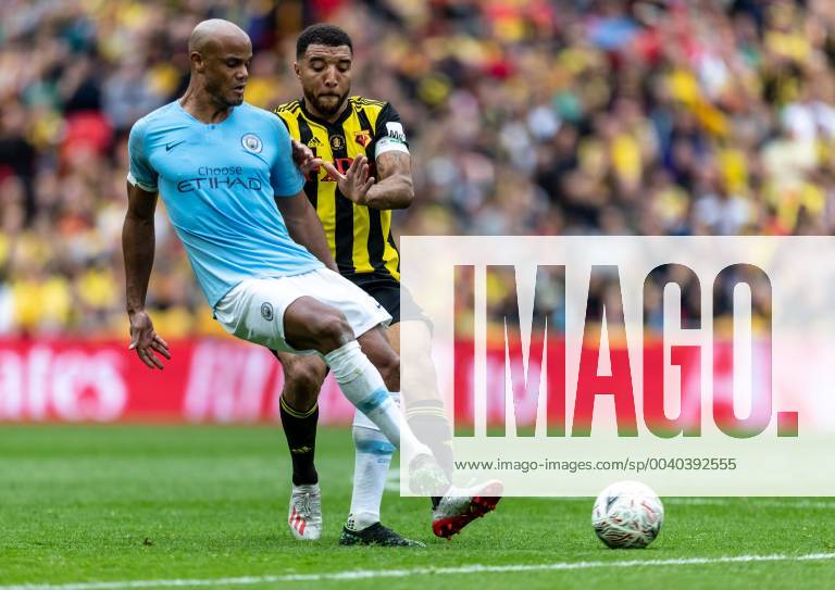 Vincent Kompany of Manchester City and Troy Deeney of Watford during the FA CUP FINAL match between Manchester City and Watford at Wembley Stadium, London, England on 18 May 2019.