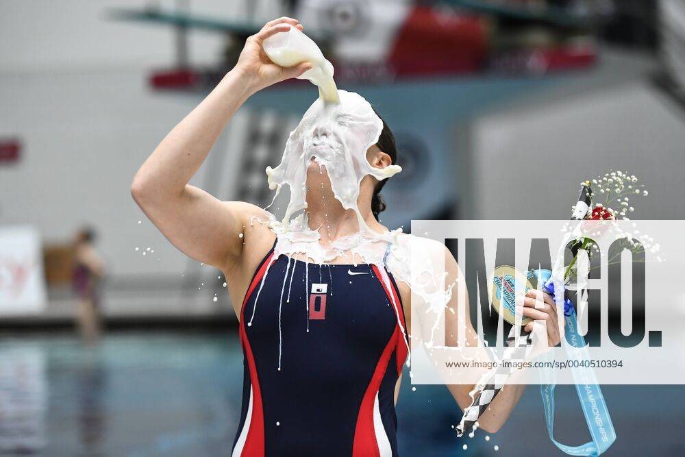 Indianapolis, Indiana, US - AMY MAGANA pours milk over her head following her win at the University of Indiana Natatorium in Indianapolis, Indiana. 2019 US Diving Senior National Diving Championships - Senior Wone Platform Final - ZUMAs146 20190525_zap_s146_020