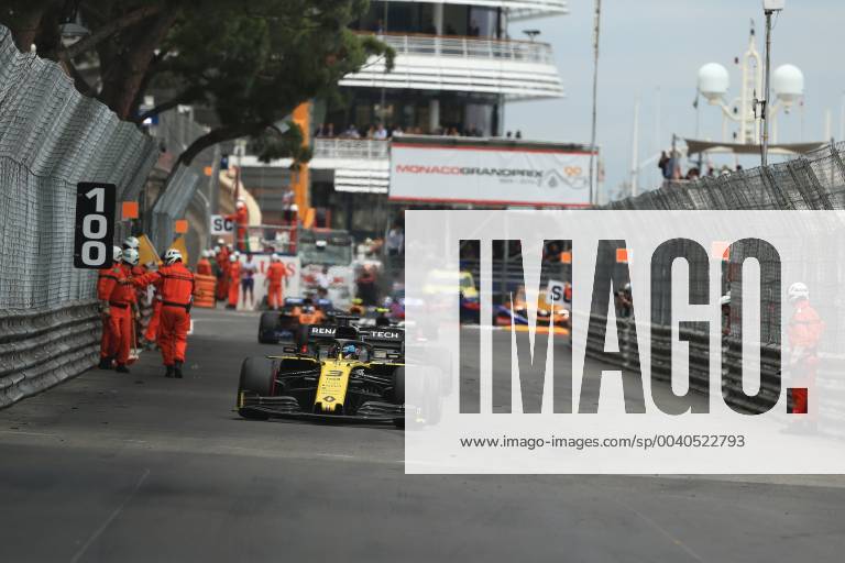 26th May 2019, Monte Carlo, Monaco; F1 Grand Prix of Monte Carlo, race day; Marshalls clear the circuit from debris while Renault F1 Team, Daniel Ricciardo passes them ActionPlus12138148 Octane