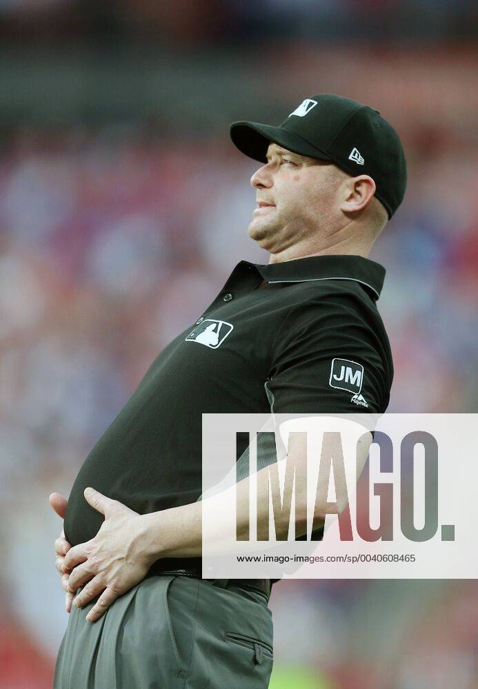 KW22 First base umpire Mike Estabrook tries to loosen up during the second inning of the Chicago Cubs-St. Louis Cardinals baseball game at Busch Stadium in St. Louis on May 31, 2019. SLP2019053113 BILLxGREENBLATT