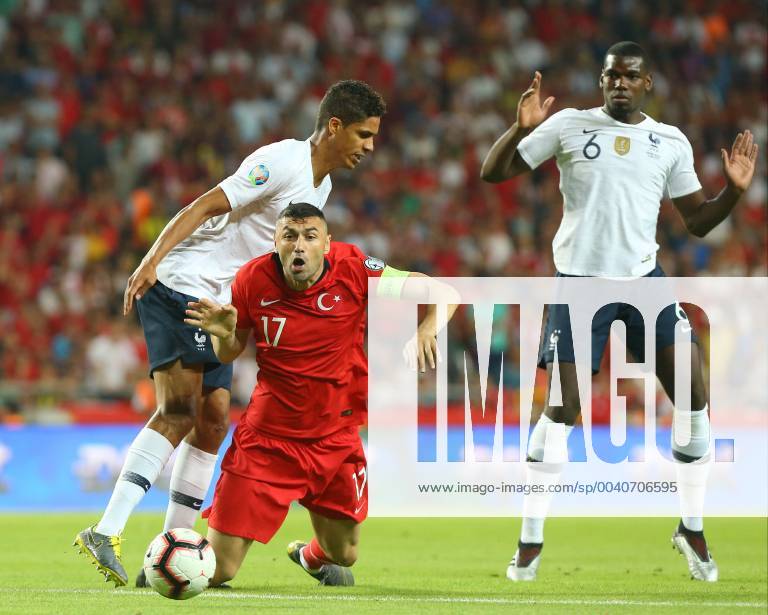Fußball, EM Quali, Türkei - Frankreich Burak Yilmaz of Turkey and Rafael Varane (L) , Paul Pogba (R) of France during the Euro 2020 football qualification match between Turkey and France at the Buyuksehir Belediyesi stadium in Konya, on June 8, 2019.