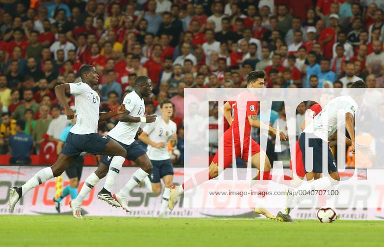 Ozan Tufan of Turkey and Paul Pogba 6 , Moussa Sissoko 17 , Raphael Varane of France during the Euro 2020 football qualification match between Turkey and France at the Buyuksehir Belediyesi stadium in Konya, on June 8, 2019.