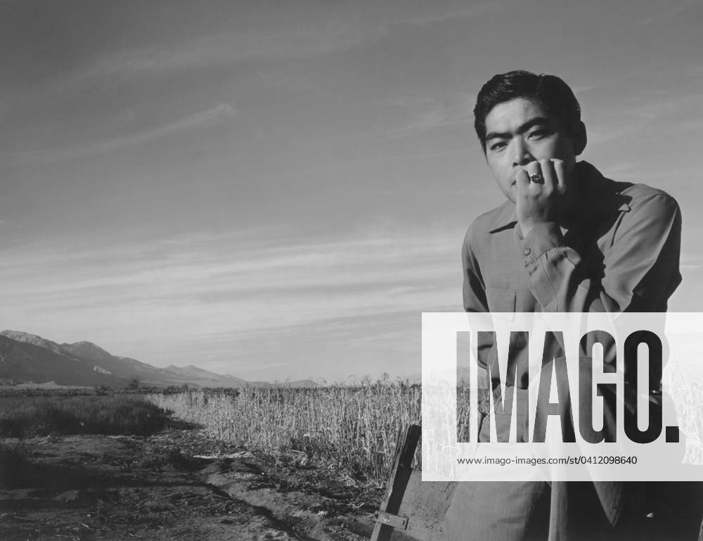 Tom Kobayashi at Manzanar Relocation Center, California, 1943 (b w photo) 1273849 Tom Kobayashi at Manzanar Relocation Center, California, 1943 (b w photo) by Adams, Ansel (1902-84) ; Private Collection; (add.info.: After Japan bombed Pearl Harbor in 1941, fear of a Japanese invasion and subversive acts by Japanese-Americans prompted the designation of the West Coast as a military zone from which any or all persons may be excluded. Japanese-Americans were singled out for evacuation. More than 110,000 people of Japanese ancestry were removed from their homes in California, southern Arizona, and western Washington and Oregon and sent to ten relocation camps. Ansel Adams series of photographs document life at Manzanar War Relocation Cente