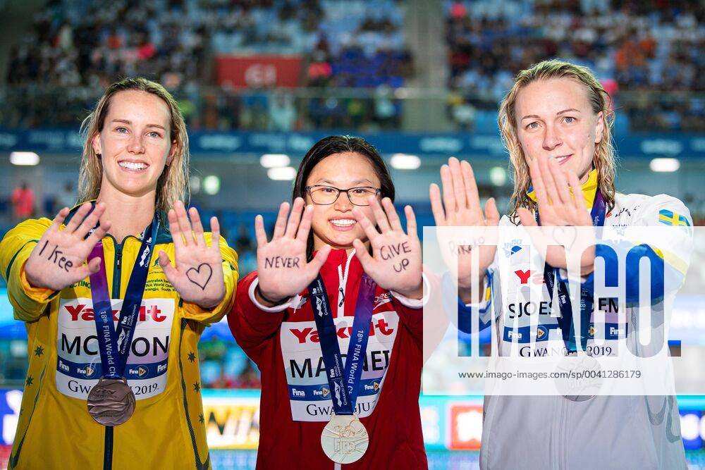 Emma McKeon of Australia (bronze), Margaret MacNeil of Canada (gold) and Sarah Sjöström of Sweden (silver) pose with a message for Japanese swimmer Rikako Ikee who is sick in leukaemia, after the final of women s 100 meter butterfly swimming during the FINA World Championships on July 22, 2019 in Gwangju. Photo: Joel Marklund BILDBYRAN kod JM 87996 BBENG FINA World Championships FINA World Championships 2019 VM sim-VM simning swimming final dam Sverige Sweden Kanada Canada Australia Australien Rikako Ikee Japan leukemia leukemi cancer