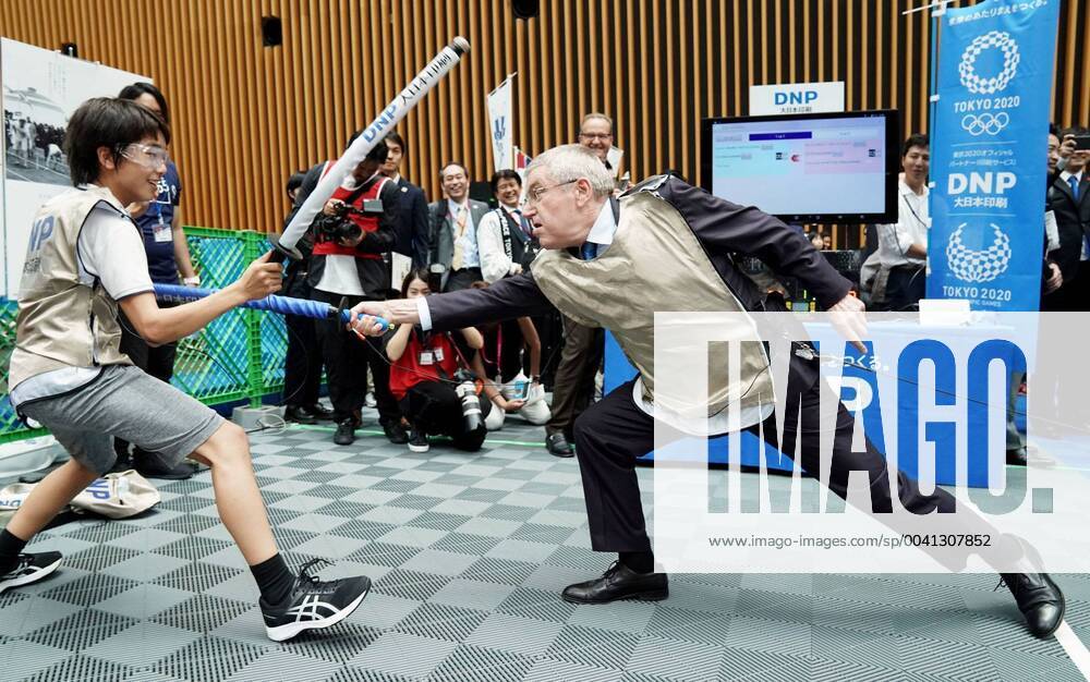 KW30 One year to 2020 Tokyo Olympics International Olympic Committee President Thomas Bach (R) fences at a promotional event in Tokyo on July 24, 2019, for the 2020 Olympics in the Japanese capital. The day marked the start of the one-year countdown to the opening of the Olympics. (Pool photo)
