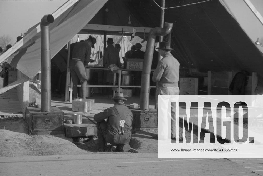 The kitchen in the camp for white flood refugees at Forrest City, Arkansas, 1937 (b w photo) 3666440 The kitchen in the camp for white flood refugees at Forrest City, Arkansas, 1937 (b w photo) by Evans, Walker (1903-75); Private Collection; (add.info.: Photograph taken for the U.S. Resettlement Administration: a New Deal U.S. federal agency that, between April 1935 and December 1936, relocated struggling urban and rural families to communities planned by the federal government. ).