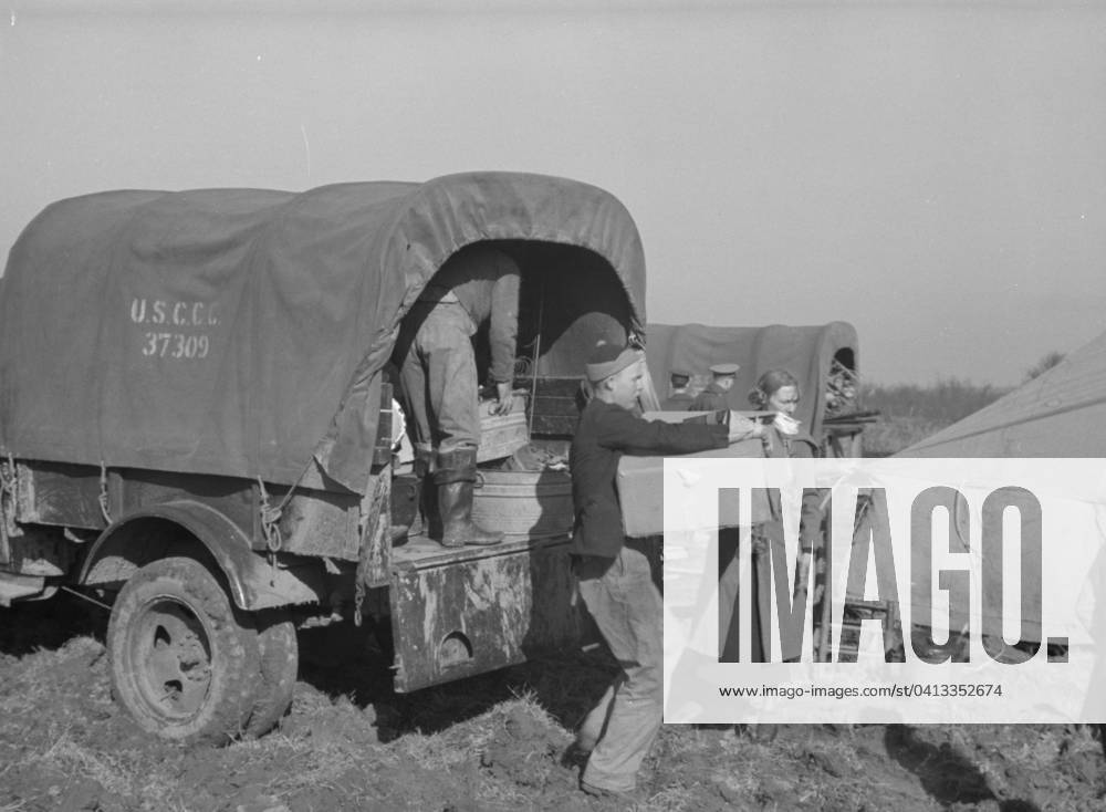 Unloading the household goods of a family who is being moved into the camp for white flood refugees at Forrest City, Arkansas, 1937 (b w photo) 3666449 Unloading the household goods of a family who is being moved into the camp for white flood refugees at Forrest City, Arkansas, 1937 (b w photo) by Evans, Walker (1903-75); Private Collection; (add.info.: Photograph taken for the U.S. Resettlement Administration: a New Deal U.S. federal agency that, between April 1935 and December 1936, relocated struggling urban and rural families to communities planned by the federal government. ).