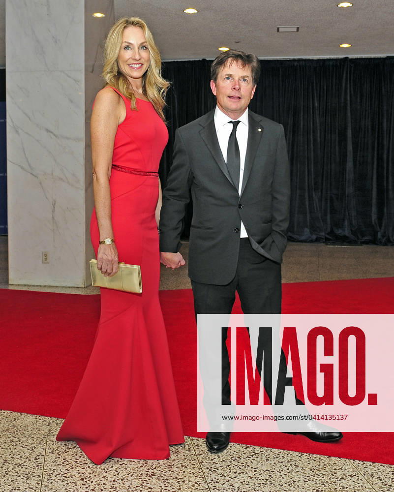 Michael J. Fox and his wife, Tracy Pollan, arrive for the 2013 White House Correspondents Association Annual Dinner at the Washington Hilton Hotel on Saturday, April 27, 2013..Credit: Ron Sachs CNP.(RESTRICTION: NO New York or New Jersey Newspapers or newspapers within a 75 mile radius of New York City)