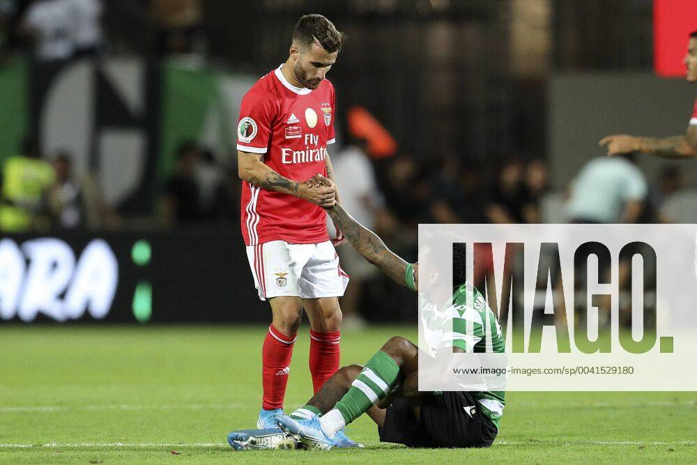 Rafa Silva of SL Benfica helps Wendel (Marcus Wendel Valle da Silva) of Sporting CP off the floor during the Final Cândido de Oliveira SuperCup 2019 football match between SL Benfica vs Sporting CP. Super Cup - SL Benfica vs Sporting CP in Lisbon, Portugal - 04 Aug 2019 - ZUMAs197 20190804_zaa_s197_244