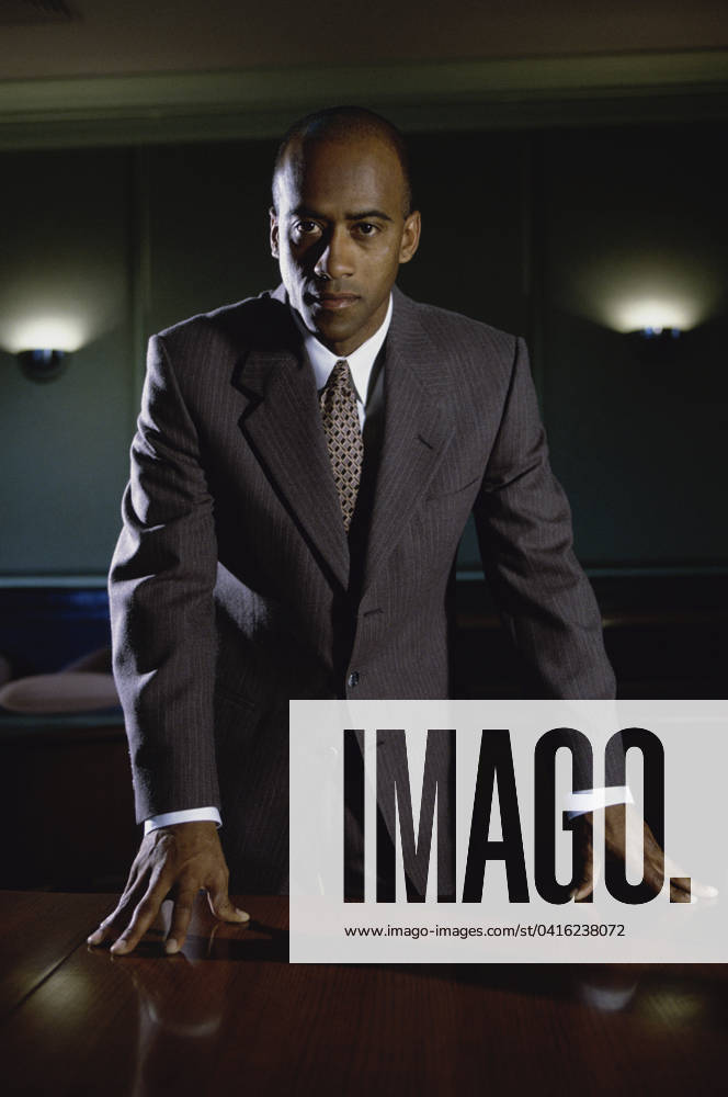 Portrait of a young businessman standing in his office