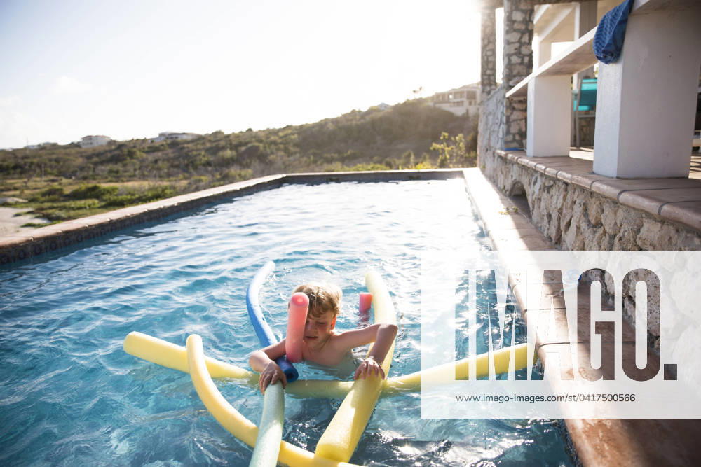 Young Boy Swims With Pool Noodles in Infinity Pool South Hill Village, Anguilla CR_EMJA240225-108745-01 ,model released, Symbolfoto