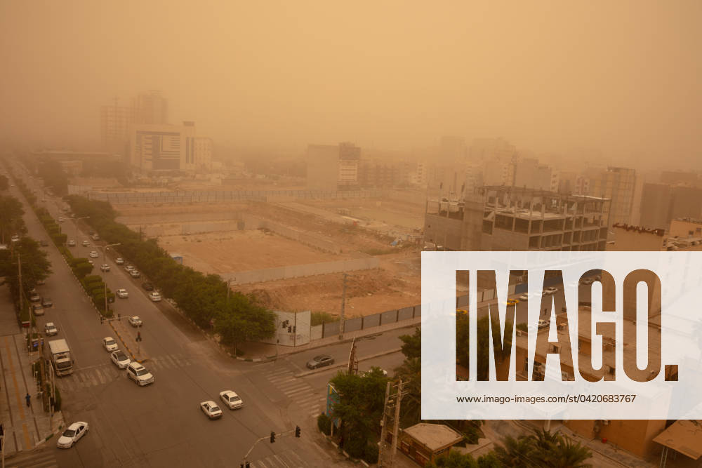 A City Under Dust Clouds 05 06 2020 Ahvaz, Iran. A view of streets and buildings blanketed in a thick haze, in Ahvaz, Khuzestan Province, Iran. Ahvaz has been consistently ranked as one of the world s worst cities for air pollution according to the World Health Organization, topping the list on numerous occasions in the last decade. Air quality is often many times worse than safety limits set by international organizations. Industrial sources, chief among them the refineries and other components of the vast petrochemical industry in Khuzestan Province, as well as massive dust storms, are the main contributors to air pollution. The poor air quality has a significant impact on the lives of the residents of Ahvaz. Each year, thousands seek m