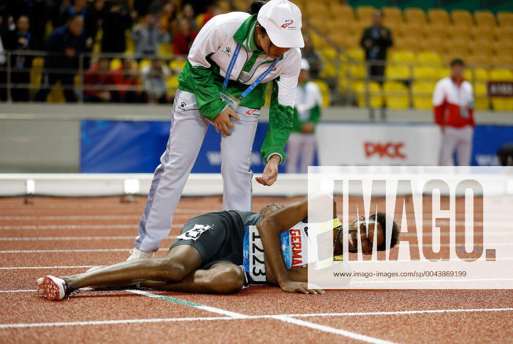 KW43 (191026) -- WUHAN, Oct. 26, 2019 -- Amanal Petros of Germany falls down after he crosses the finishing line during the men s 5000m final of track and field at the 7th CISM Military World Games in Wuhan, capital of central China s Hubei Province, Oct. 26, 2019. ) (SP)CHINA-WUHAN-7TH MILITARY WORLD GAMES-TRACK & FIELD WangxLili