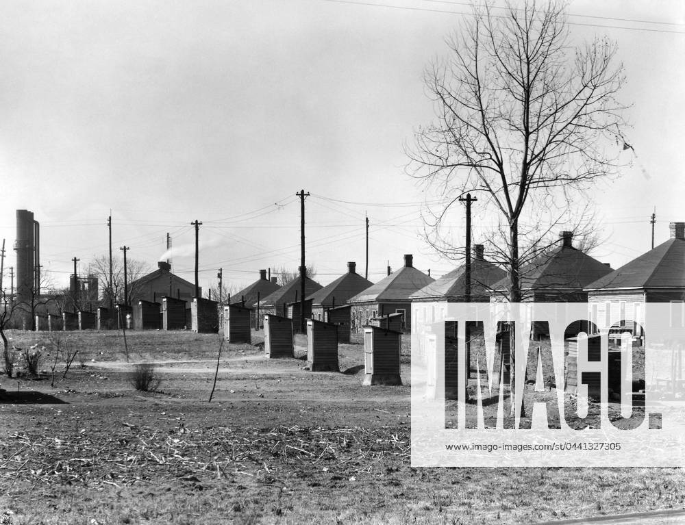 ALABAMA: HOUSING, 1936. Steelmill workers company housing with outhouses at the Republic Steel Company, Birmingham, Alabama. Photograph by Walker Evans in March 1936.