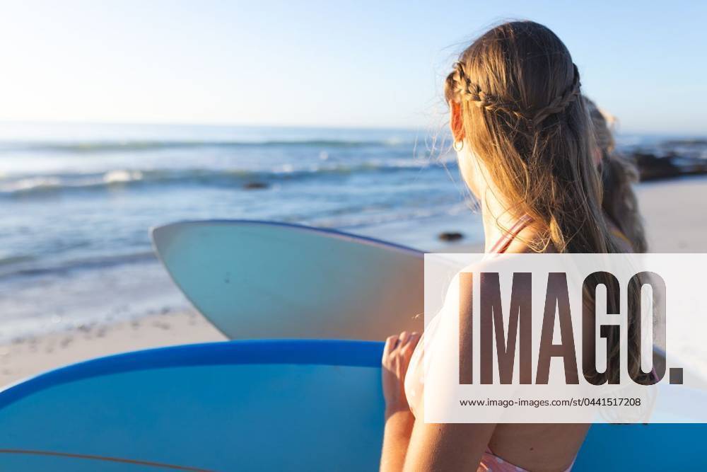Young Caucasian woman holds a surfboard on the beach, with copy space Young Caucasian woman holds a surfboard on the beach, with copy space. She s ready for a surfing session in the ocean at sunrise., model released, , property released, Cape Town, South Africa, 2024-01-23T22:00:00.000Z, 5113212.jpg, people,Caucasian woman,surfboard,beach,surfing,ocean,sunrise,copy space,wave,water,sport,activity,outdoor,leisure,lifestyle,adventure,young,female,girl,beachwear,vacation,travel,sea,horizon,sky,summer,holiday,coastline,recreational,healthy,fitness,wellness,energetic,active,hobby,nature,morning,dawn,sunshine,warm,beautiful,fun,enjoyment,excitement,challenge,athletic,exercise,motion,dynamic,vibrant,outdoors Young Adult,Woman,Female,White