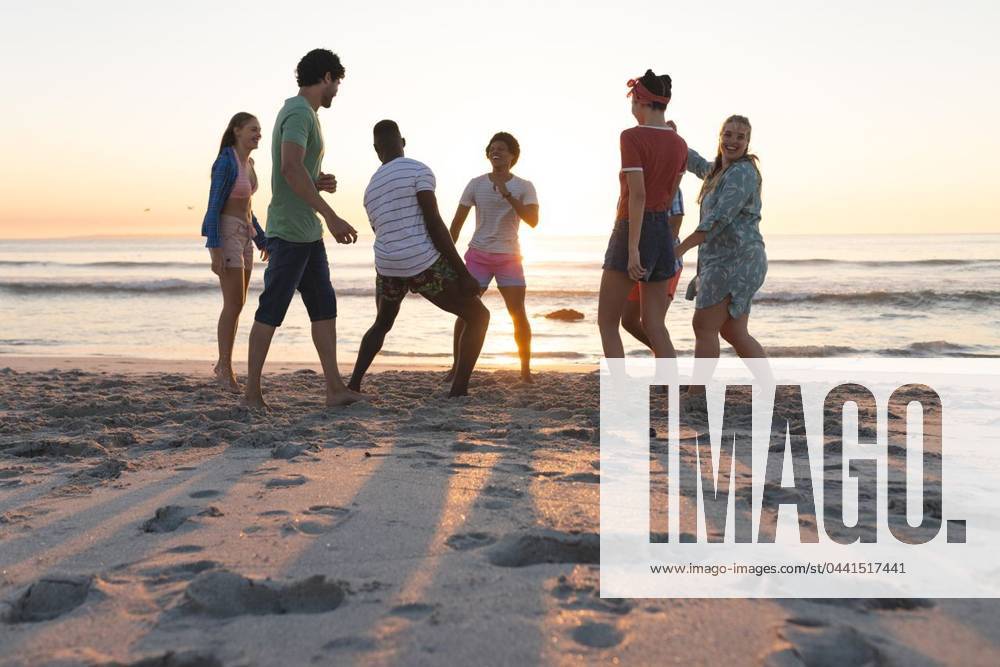 Diverse group of friends enjoy a beach outing at sunset Diverse group of friends enjoy a beach outing at sunset. Laughter and conversation fill the air as they savor the coastal ambiance., model released, , property released, Cape Town, South Africa, 2024-01-23T22:00:00.000Z, 5113251.jpg, people,diverse friends,beach outing,sunset,laughter,conversation,coastal ambiance,enjoyment,group,friendship,beach,outing,friends,coastal,ambiance,diverse,sunset beach,diverse group,sunset outing,beach enjoyment,friends laughter,coastal conversation,diverse ambiance,group friendship,sunset laughter,diverse enjoyment,friends beach Young Adult,Man,Male,Black,Multiracial,Woman,Female,White