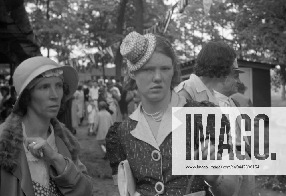 INDEPENDENCE DAY, 1935. Women at an Independence Day celebration in Terra Alta, West Virginia. Photograph by Walker Evans, 1935.