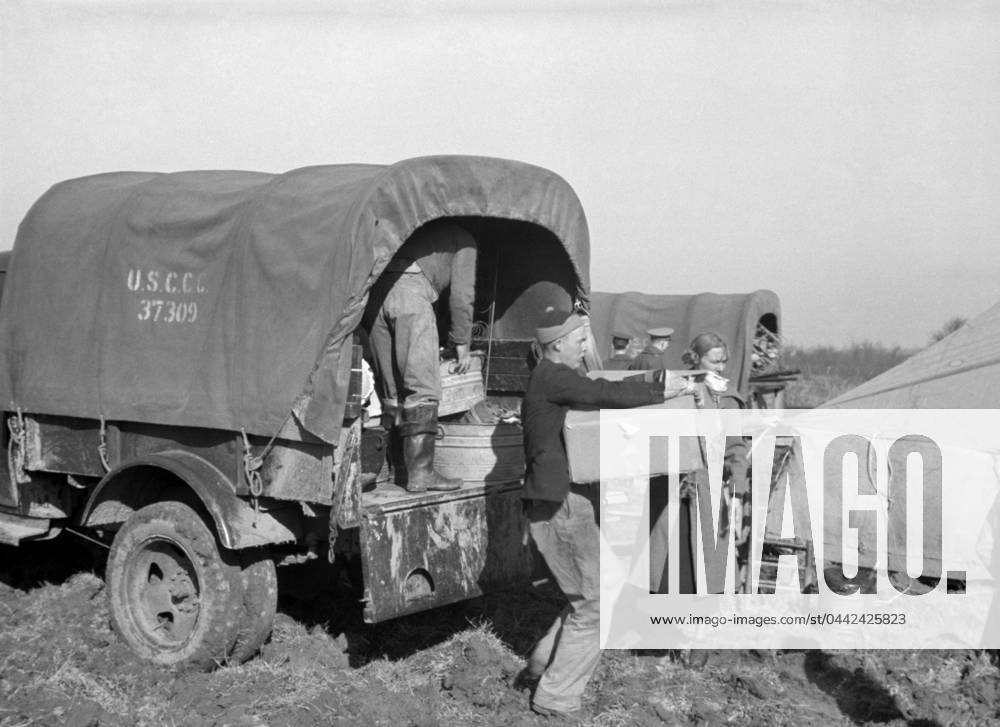 ARKANSAS: FLOOD CAMP, 1937. A family moving into a camp for white flood refugees at Forrest City, Arkansas. Photograph by Walker Evans, February 1937.