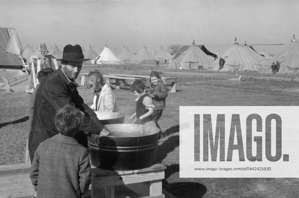 ARKANSAS: FLOOD CAMP, 1937. Washing up facilities in a camp for white flood refugees at Forrest City, Arkansas. Photograph by Walker Evans, February 1937.