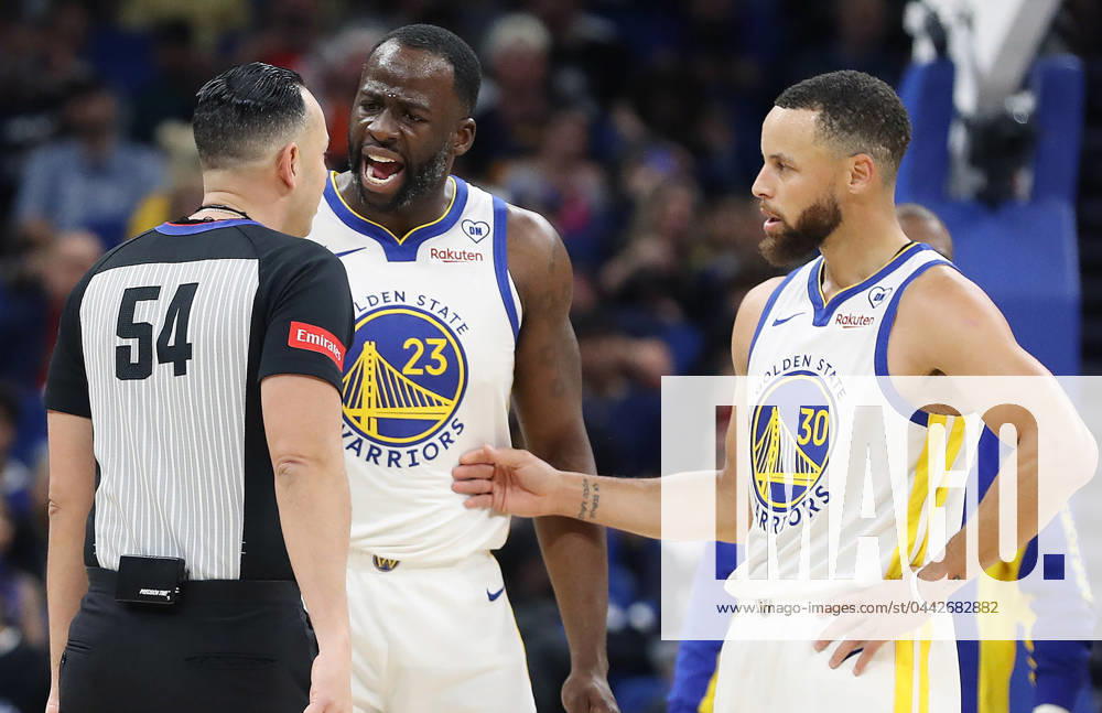 Orlando, FL - Florida, USA: The Golden State Warriors Draymond Green (23) screams at game official Ray Acosta (54) as teammate Stephen Curry (30) steps in at right during action against the Orlando Magic at the Kia Center on Wednesday, March 27, 2024, in Orlando, Florida. Orlando USA - ZUMAm67_ 20240327_zaf_m67_039