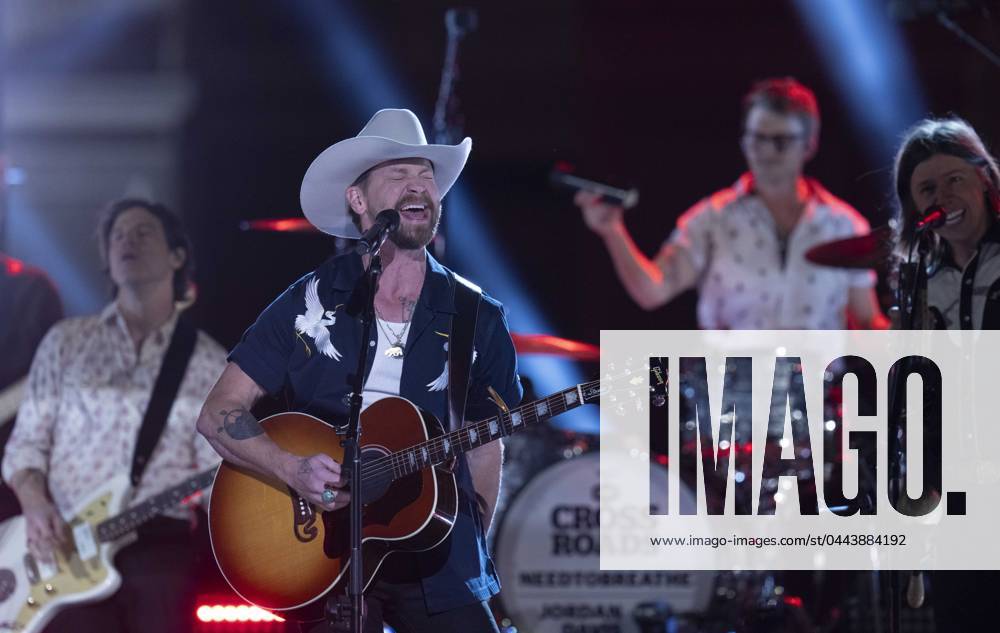 American country rock band NEEDTOBREATHE with lead singer BEAR RINEHART performs at a taping of CMT Country Crossroads in front of the University of Texas Tower on April 5, 2024. At right is bassist SETH BOLT Austin United States - ZUMAd150 20240405_znp_d150_014